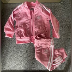 Infant Pink and white Adidas track suit.